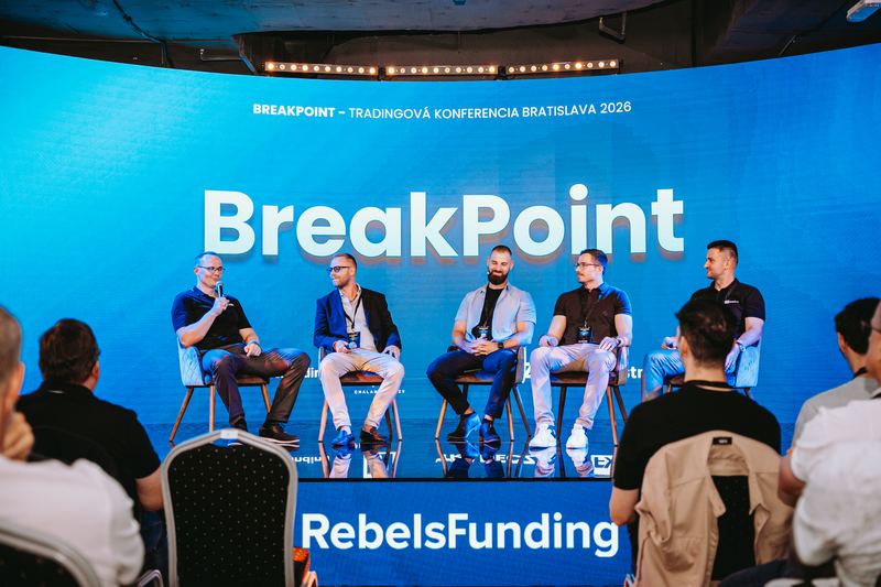 Panel on stage with RebelsFunding branding