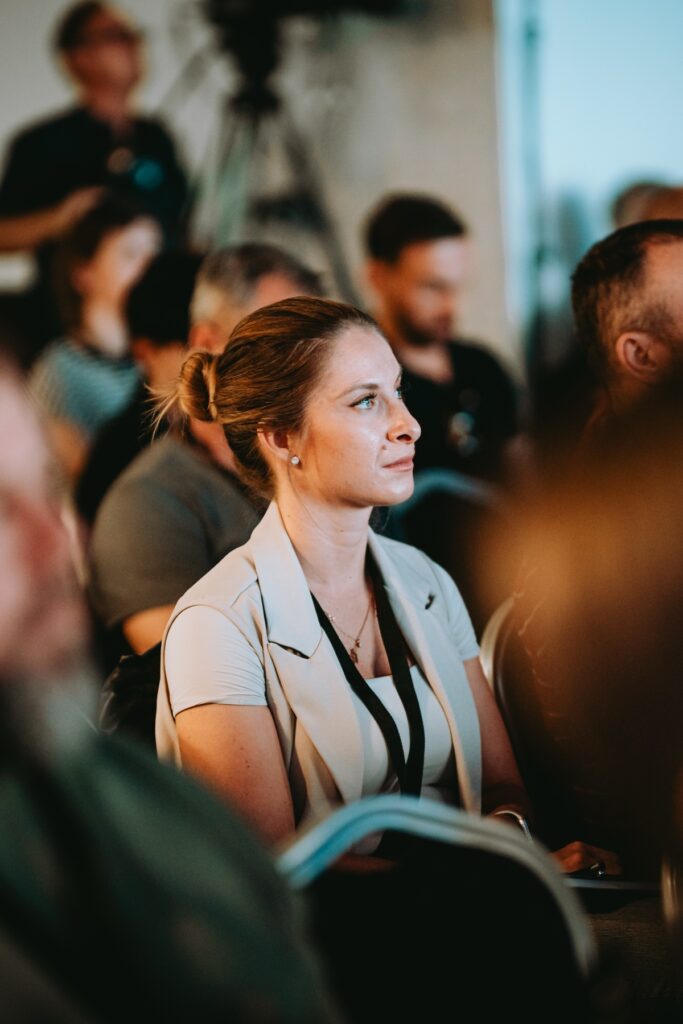 Trader in the audience listening to a talk